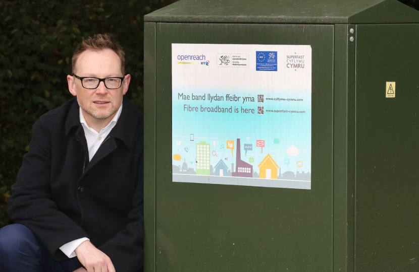 Russell stood with a broadband exchange box.