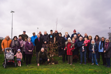 Picture of Russell George and Ian Harrison with the community at tree planting event in Guilsfield.