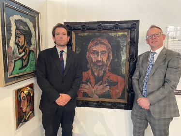 Dan Llywelyn Hall pictured with Russell George at his gallery.