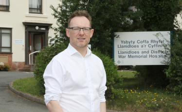 Russell George MS pictured outside Llanidloes Hospital