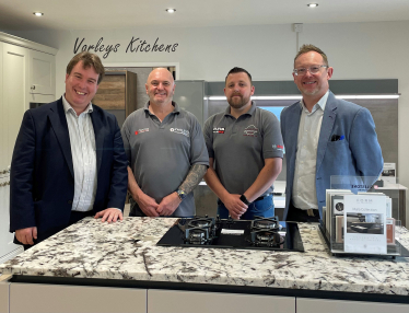 Montgomeryshire MP Craig Williams (left) and MS Russell George (right) with Joe Varley and his assistant Carl Williams in the new LochAnna kitchens showroom at the Varleys of Newtown on Saturday.