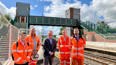 Russell George MS pictured with Network Rail team at Newtown train station.