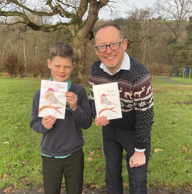  Evan Morgan, aged 10, with Russell George MS